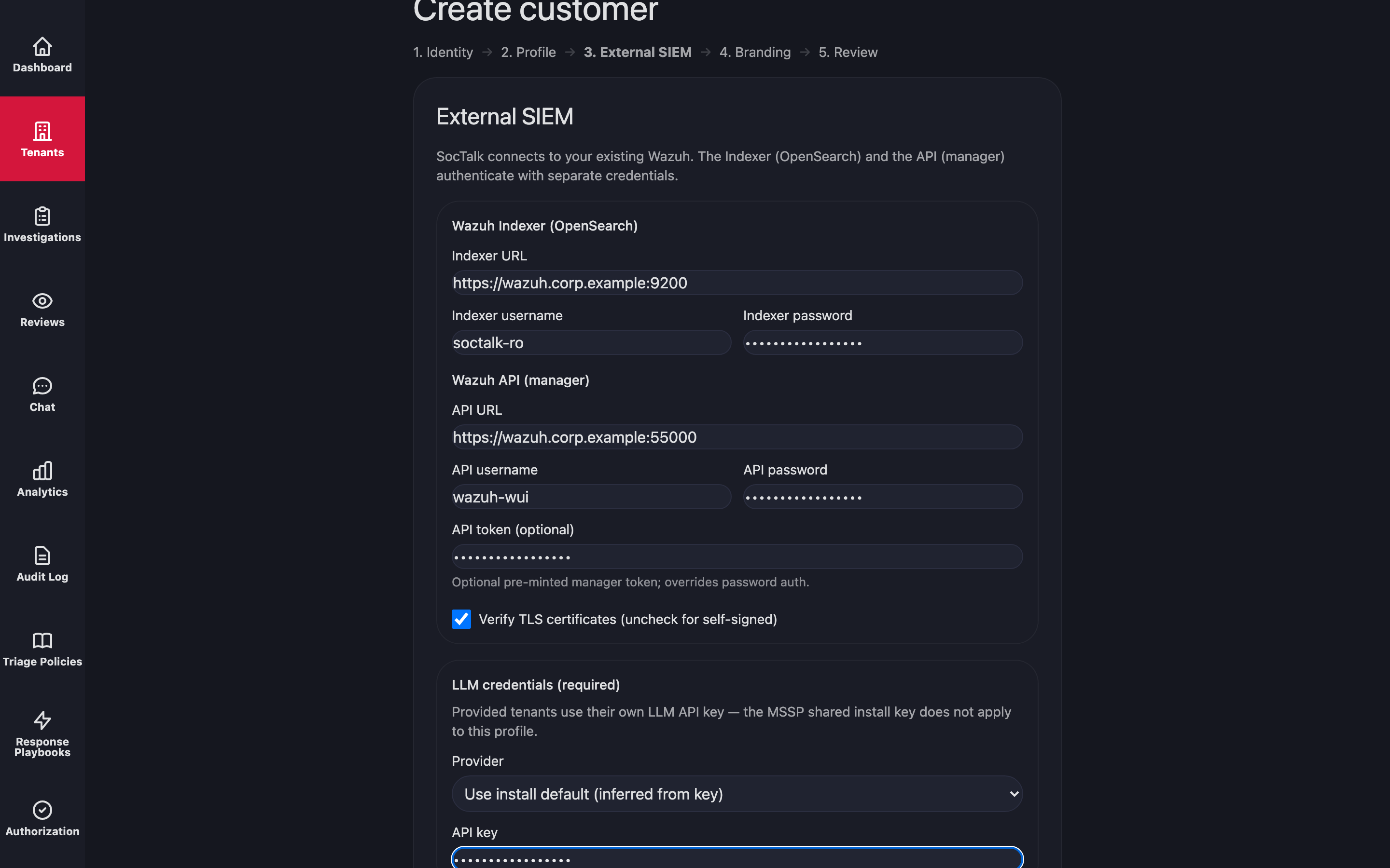 The External SIEM wizard step: indexer URL and credentials, manager API URL and credentials, an optional pre-minted API token, a Verify TLS certificates checkbox to uncheck for self-signed, and the required per-tenant LLM key